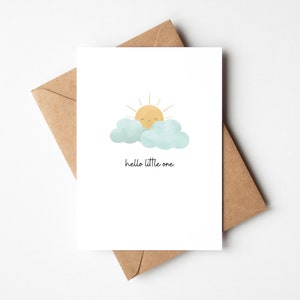 Minimalist New Baby Card that reads Hello Little One. The illustrations is of a cute, happy sunshine peeking out from behind some fluffy clouds