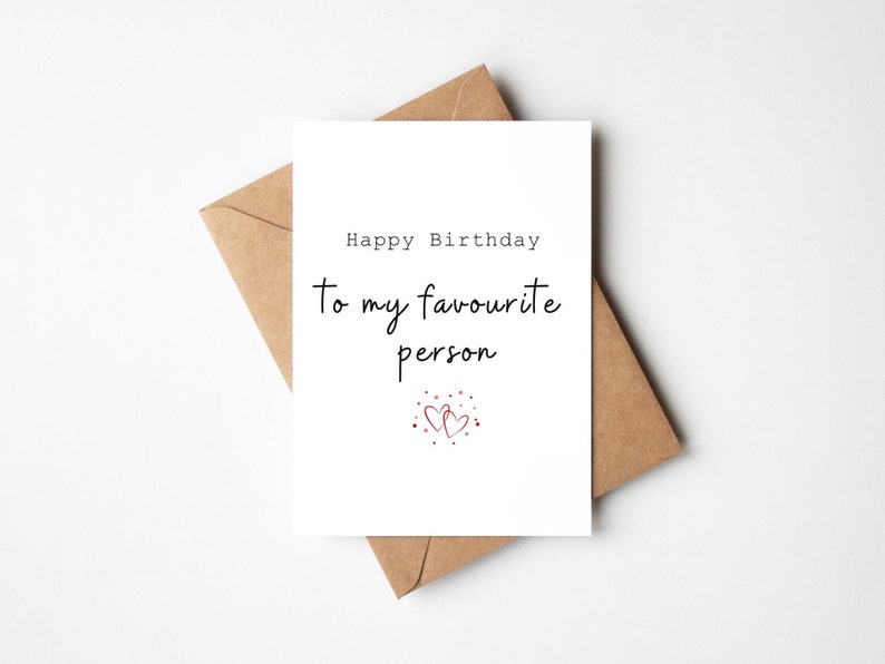 White card with the text 'Happy Birthday to my Favourite Person'. Underneath are two interlocked red hearts