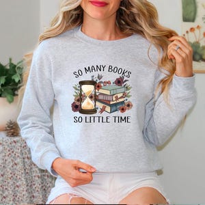 May include: Grey sweatshirt with the text "So many books, so little time" and a graphic of an hourglass and a stack of books with flowers.