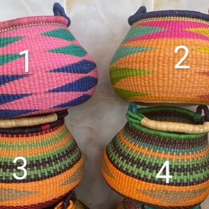 May include: Four colorful woven baskets with different patterns. The baskets are numbered 1 through 4.