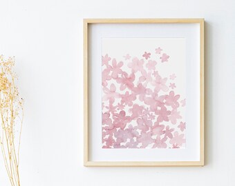 May include: A framed watercolor print of pink flowers on a white background. The frame is made of light wood and has a simple design.