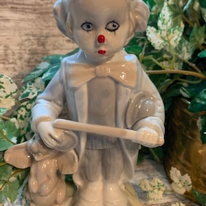 Vintage Porcelain Clown Figurine Sculpture Holding Stick with dog