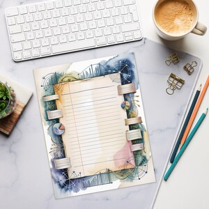 May include: A lined paper with a watercolor design featuring charts, graphs, and circular elements. The paper is held together with silver clips. A keyboard, coffee cup, pencils, and binder clips are also visible.