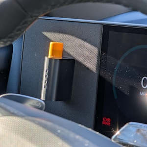 May include: A set of three ceramic mugs with a speckled, matte finish. The mugs are in shades of cream, light gray, and dark gray. Each mug has a simple, minimalist design, perfect for coffee or tea.