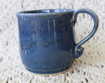 Ceramic mug, hand-thrown with a unique and sturdy hand-pulled handle. Midnight blue glaze. Signed and dated.