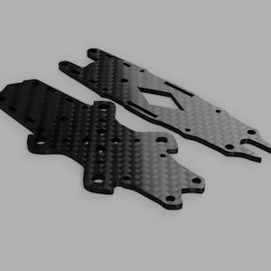 May include: Two black carbon fibre plates for a drone or other small aircraft. The plates have a honeycomb pattern and are designed to be lightweight and strong.