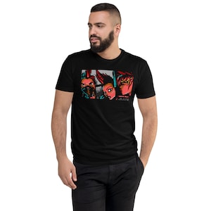 Puede incluir: Camiseta negra con una imagen pixelada de tres personas con acentos rojos y azules. El texto "Street Fighter" está impreso debajo de la imagen.