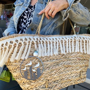 a person is holding a woven basket