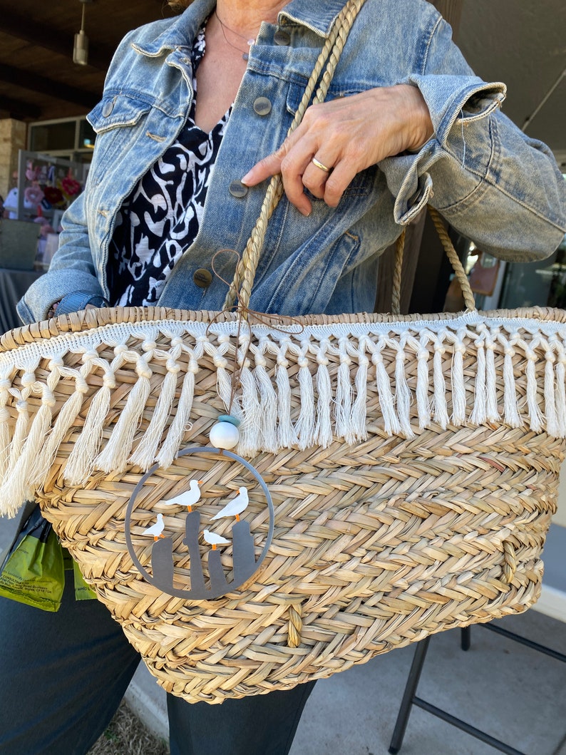 a person is holding a woven basket