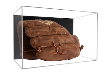 May include: A brown leather baseball glove is enclosed within a clear rectangular acrylic display case. The case features a solid black back panel, providing a high-contrast backdrop for the worn, textured surface of the baseball mitt inside.