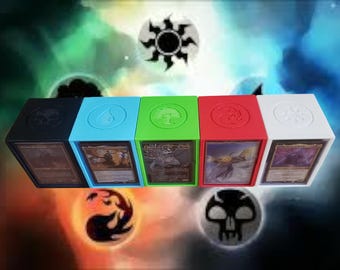 May include: Five different colored card boxes with symbols on the front. The boxes are black, blue, green, red, and white. The symbols are a black circle, a blue flame, a green tree, a red swirl, and a white circle.