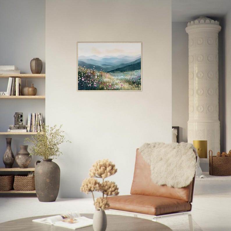 May include: A rectangular framed wall art print featuring a watercolor landscape of rolling blue mountains behind a vibrant meadow filled with colorful wildflowers in shades of pink, white, and yellow under a soft, pale sky.