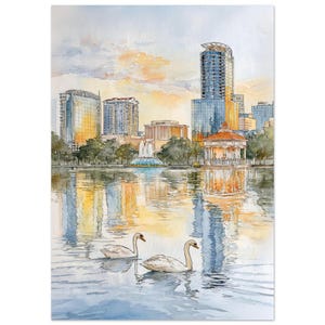 Op de afbeelding: Aquarel schilderij van een stadsgezicht met een meer op de voorgrond. Twee witte zwanen zwemmen op het water. Gebouwen en een prieel weerspiegelen in het water. De lucht is een mix van oranje, geel en blauw.