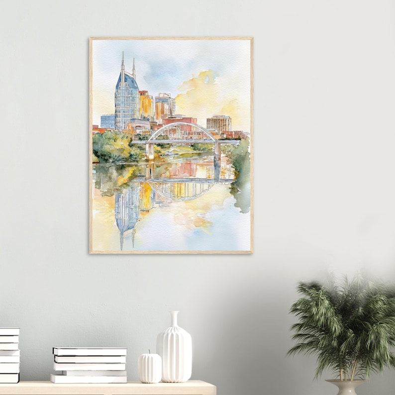 Puede incluir: Pintura a la acuarela de un paisaje urbano con un puente sobre el agua. Los edificios son en tonos dorados, naranjas y azules. El puente es blanco con detalles rojos. El agua refleja los edificios y el cielo.