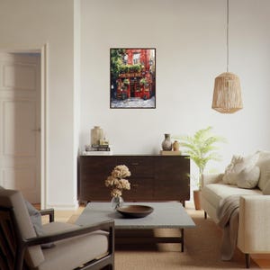 May include: A framed wall art print depicting a vibrant red building with the text The Temple Bar displayed above the entrance. The scene features a cobblestone street, green foliage, and traditional architectural details in a painterly style.