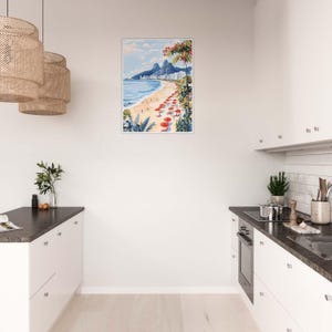 May include: A framed print of a beach scene with red umbrellas and palm trees in the foreground, and a city skyline in the background.