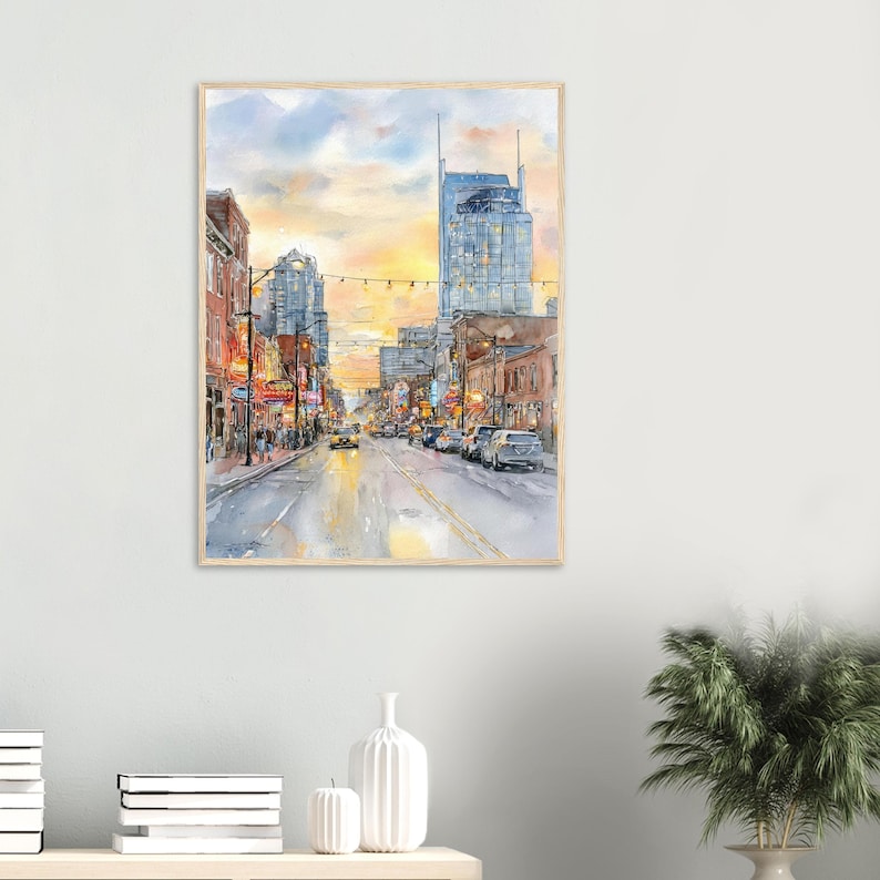 May include: A watercolor painting of a city street at sunset, featuring tall buildings, glowing streetlights, and cars driving along a road. The sky is a blend of soft yellow, orange, and blue hues, reflecting light onto the wet pavement below.