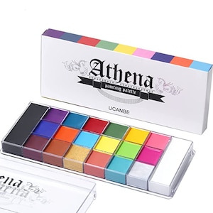 May include: A white box with the text "Athena painting palette" and the brand name "UCANBE". The box is open to reveal a clear plastic palette with 16 paint colors, including black, white, silver, gold, red, orange, yellow, green, blue, and purple.