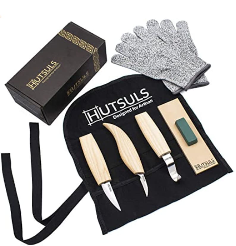 May include: A set of four wood carving knives with leather sheath, sharpening stone, and protective gloves. The knives have wooden handles and are labeled "Hutsuls Designed for Artisan".