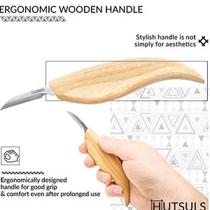 May include: A close-up of a wooden carving knife with a curved blade and a wooden handle. The handle is ergonomically designed for a comfortable grip. The knife is made by Hutsuls.