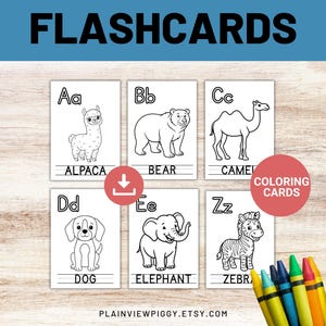 May include: White flashcards with black outlines of animals, including an alpaca, bear, camel, dog, elephant, and zebra. The word "FLASHCARDS" is at the top. The cards are labeled with letters and animal names. Crayons are in the bottom right.