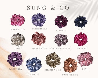 May include: A collection of 12 silk scrunchies in various colors, including carnation, periwinkle, navy, sangria, ivory, dusty rose, dusty lavender, cherry, wisteria, ice blue, champagne, cafe creme, and pink.
