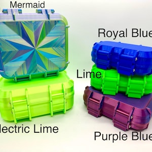 May include: Four stackable storage containers in different colours. The top container is a teal blue with a geometric pattern and the text "Mermaid". The second container is bright green and the text "Lime". The third container is a bright blue and the text "Royal Blue". The bottom container is a purple and the text "Purple Blue".