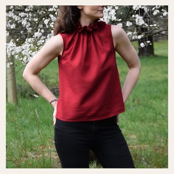 Sleeveless ruffle neck top hotsell