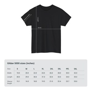May include: Black t-shirt with measurements for width, length, and sleeve length. The Gildan 5000 sizes are listed in inches, ranging from S to 5XL. The width ranges from 18.0 to 32.0 inches, length from 28.0 to 35.0 inches, and sleeve length from 15.1 to 25.0 inches.