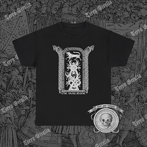 May include: Black t-shirt with a white graphic of a tree with a wolf and the text "The Vang Stone". The t-shirt has a white skull graphic with the text "Know your darkness" on the bottom right.
