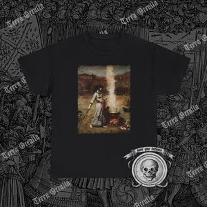 May include: Black t-shirt with a graphic print of a woman in a forest setting, holding a cauldron with steam rising from it. The text "know your darkness" is printed below the image.