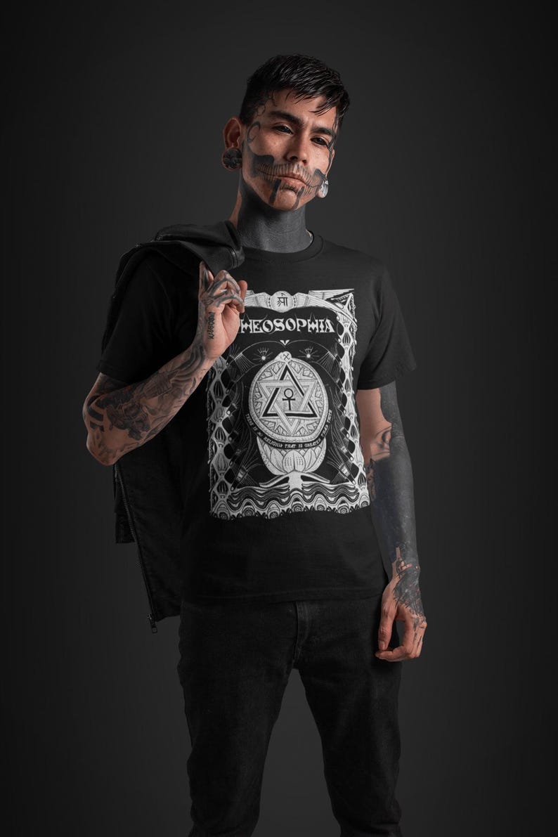 May include: A black t-shirt with a white graphic design featuring a stylized triangle with an ankh symbol inside. The text "THEOSOPHIA" is above the triangle. The graphic is surrounded by a decorative border.