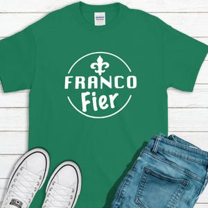 May include: Green t-shirt with a white circle design featuring a fleur-de-lis and the text "Franco Fier".