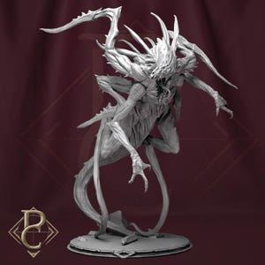 May include: A detailed grey sculpture of a monstrous creature with sharp, elongated limbs and a menacing expression. The figure has a skeletal appearance with multiple horns and a wide, open mouth. The sculpture is on a circular base.