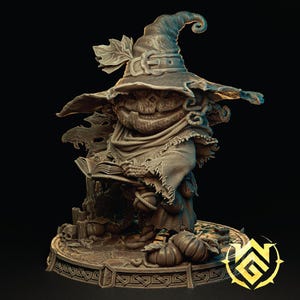 May include: A detailed sculpture of a scarecrow figure, wearing a wide-brimmed hat and a tattered scarf. The figure is holding a book and surrounded by pumpkins, with a decorative base. The color palette is primarily shades of brown and tan.