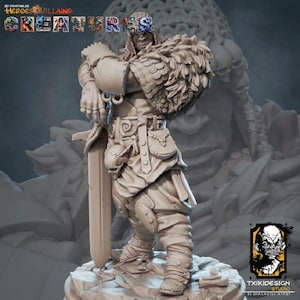 May include: A beige 3D printed miniature figure of a warrior standing on a rocky base, wearing layered armor with a fur-like shoulder mantle and holding a long sword. The text 3D PRINTABLES HEROES & VILLAINS CREATURES and TXIKIDESIGN STUDIO appear.