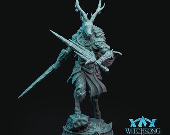 May include: A gray, detailed miniature figurine of a deer-like creature with antlers, wearing armor and holding a sword. The figurine is standing on a circular base with the text "WITCHSONG" on it.