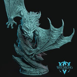 May include: A teal-colored fantasy sculpture of a dragon with large, outstretched wings. The dragon is perched on a textured base, with intricate details on its scales and facial features. The sculpture has a dynamic pose, suggesting movement. The Witchsong logo is visible.