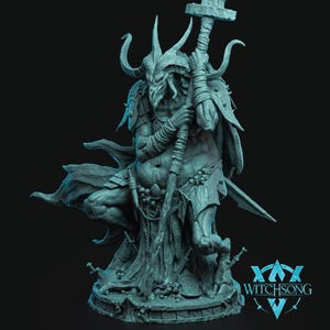 May include: A teal figurine of a horned demon, holding a staff and sword. The figure has detailed armour and a long cloak. The text "Witchsong" is visible at the base of the figurine.