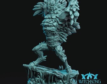 May include: A light blue, crystalline rock creature figurine standing in a dynamic pose on a jagged, icy base. The figure is composed of sharp, angular stone-like segments and shards. The Witchsong logo is visible in the bottom right corner.