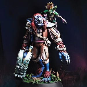May include: A detailed miniature figure of a fantasy troll with blue skin, red hair, and brown clothing, carrying a large silver hammer. A small green goblin rides on the troll's shoulder, pointing. The figures are on a base with green foliage.