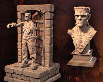 May include: A detailed, light-colored sculpture of Frankenstein's Monster. The sculpture includes a full figure in front of a stone archway with a barred gate and a bust on a pedestal. The text "FRANKENSTEIN'S MONSTER" is at the top.