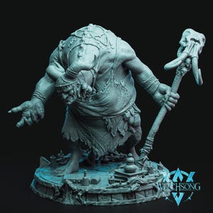 May include: A grey 3D-printed fantasy figure of a troll-like creature with horns, holding a staff topped with a skull. The figure stands on a circular base with small objects. The Witchsong logo is visible.