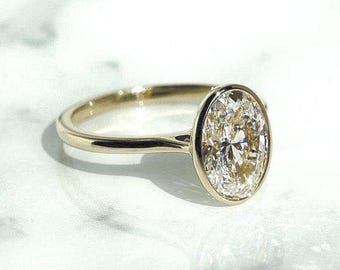 2CT Oval Moissanite Engagement Ring: 14K Yellow Gold Bezel Solitaire