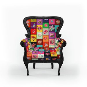 May include: A black armchair with a high back and ornate detailing. The seat and backrest feature a patchwork design of colorful floral squares. The chair has curved legs and armrests, creating a vintage aesthetic.