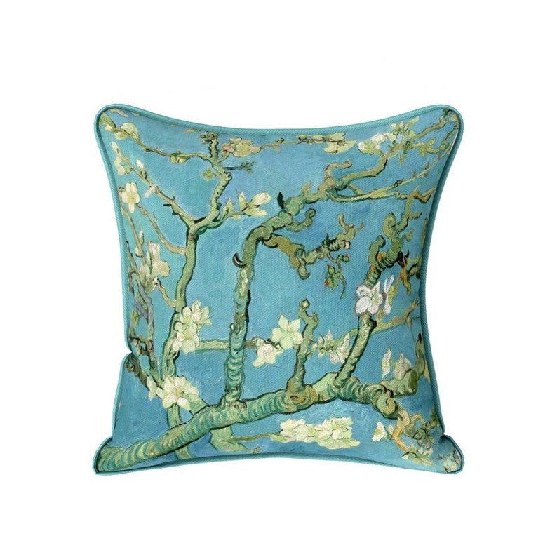 May include: A blue throw pillow with a printed image of a painting of a blooming almond tree branch. The painting is in a style reminiscent of Vincent van Gogh.