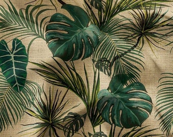 May include: A beige fabric with a green tropical leaf pattern. The leaves are a variety of shapes and sizes, including palm leaves, monstera leaves, and other tropical foliage.