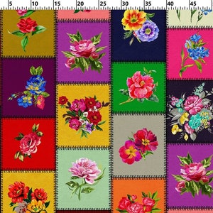 May include: A colorful patchwork fabric featuring floral designs. Each square showcases a different watercolor-style flower arrangement, including roses, peonies, and other blooms. The squares are outlined with black stitching, creating a vibrant and artistic pattern.