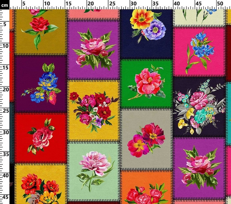 May include: A colorful patchwork fabric featuring floral designs. Each square showcases a different watercolor-style flower arrangement, including roses, peonies, and other blooms. The squares are outlined with black stitching, creating a vibrant and artistic pattern.