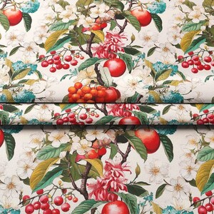 May include: A white fabric with a repeating pattern of red apples, red berries, and pink flowers. The background is a cream colour.